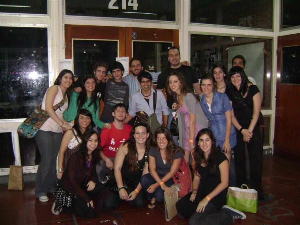 A large group of students posed together at the end of a course